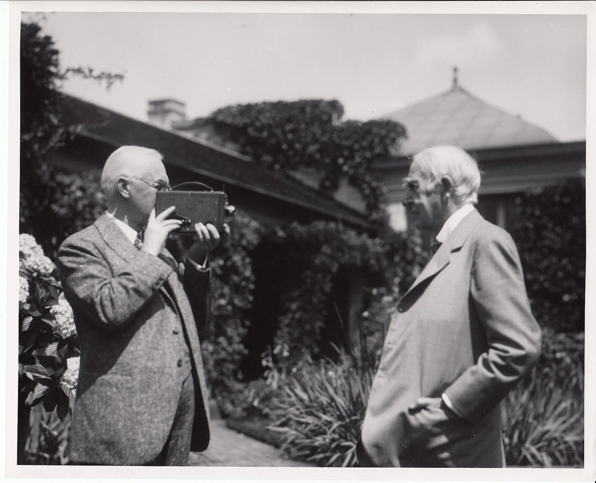 George Eastman filming Thomas Edison with a hand-held motion picture camera (1928)